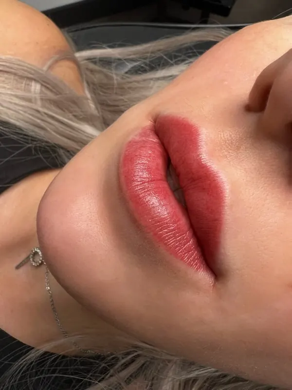 Lips with a rosy lip blush tattoo